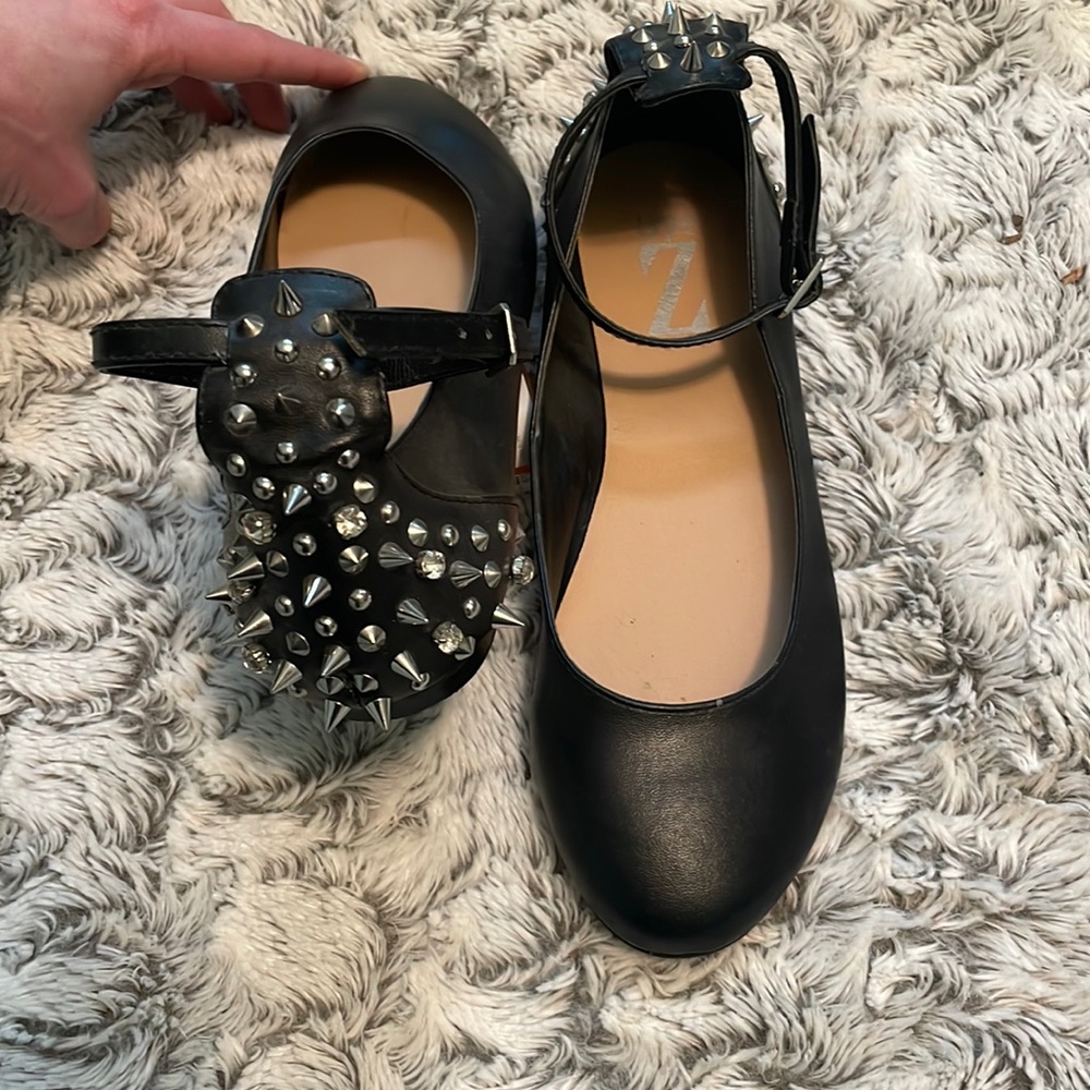 Studded black leather flats